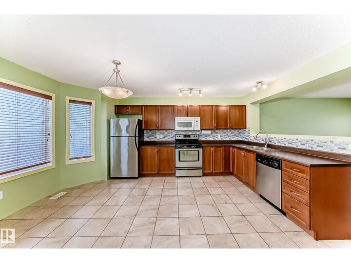 Property Photo:  7108 16 Av SW  AB T6X 0H3 