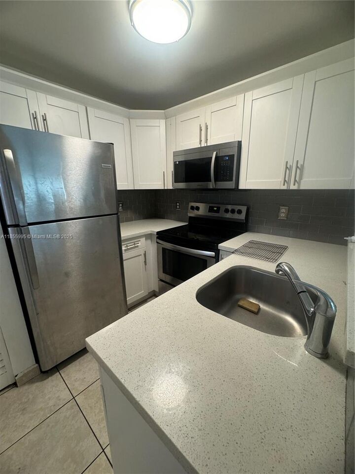 Property Photo:  2705 W 64th Pl 52-14  FL 33016 