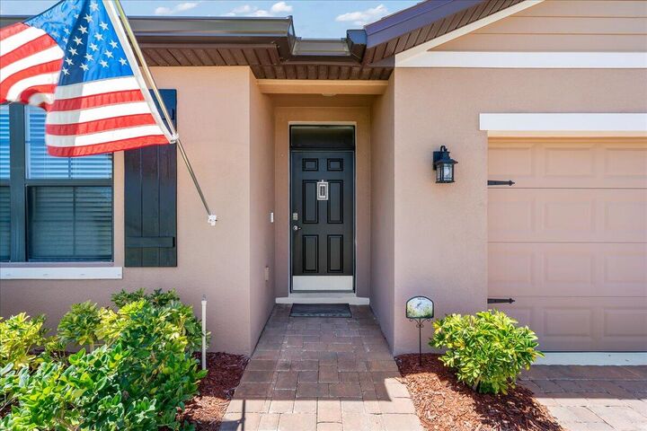 Property Photo: 7202 Tigereye Way FL 32949