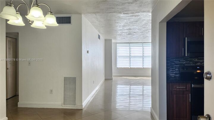 Property Photo:  1475 NE 125th Ter 408H  FL 33161 