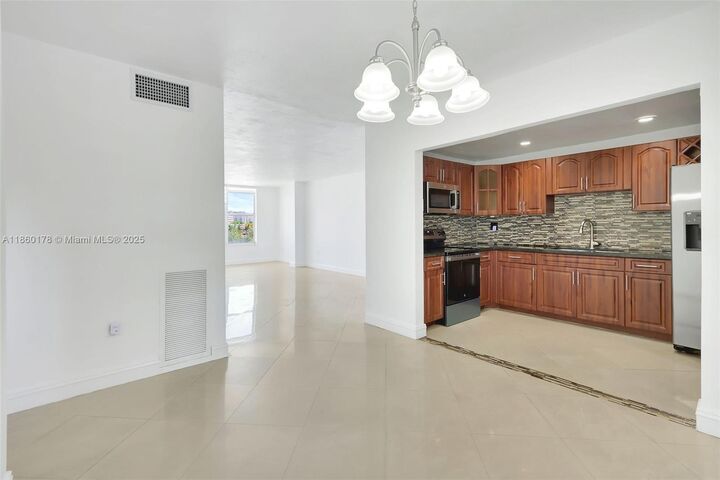 Property Photo:  1475 NE 125th Ter 408H  FL 33161 
