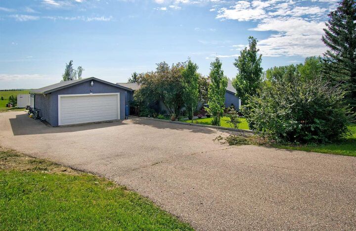 Property Photo:  104 Hill Spring Meadows  AB T4B 2A3 