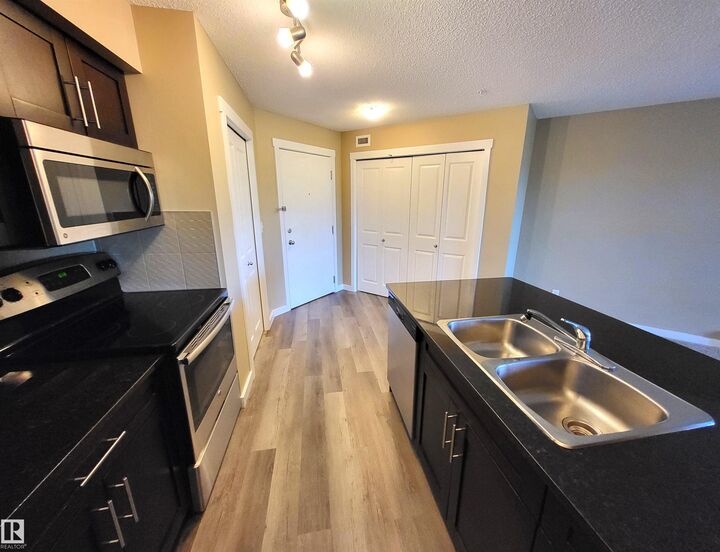 Property Photo: 1510 Watt Drive SW 313 AB T6X 2E6