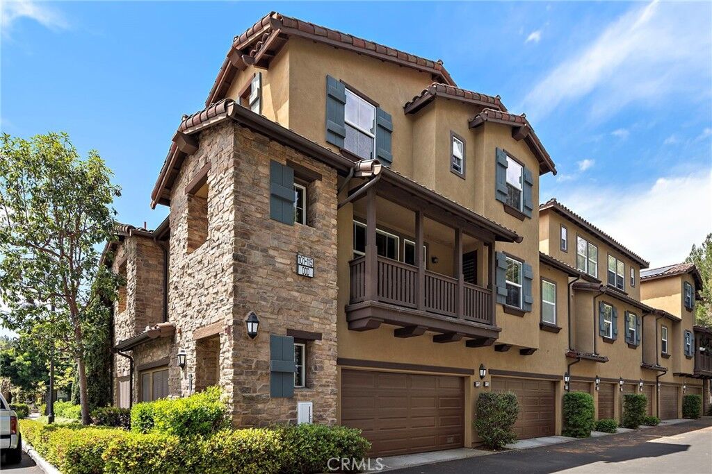 Property Photo:  115 Coral Rose  CA 92603