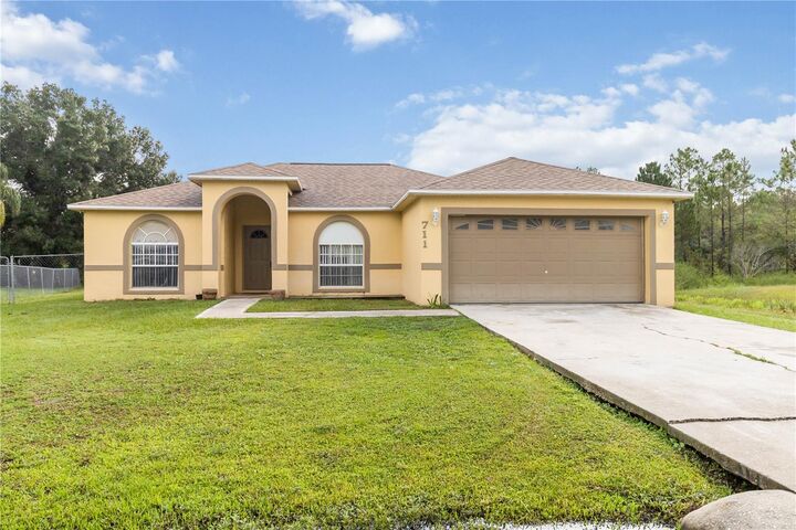 Property Photo:  711 Caracara Court  FL 34759 
