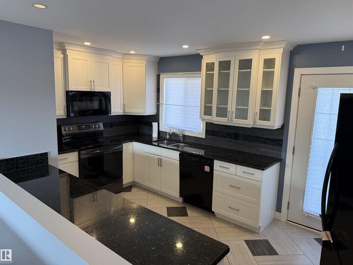 Property Photo:  13812 132 Avenue NW  AB T5L 3R8 