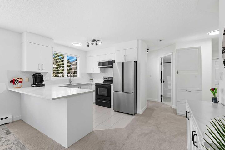 Property Photo:  7451 Springbank Boulevard SW 1211  AB T3H 4K5 