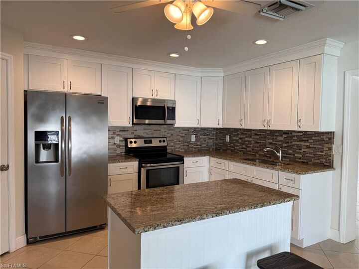 Property Photo:  6677 Fiesta Way  FL 33919 