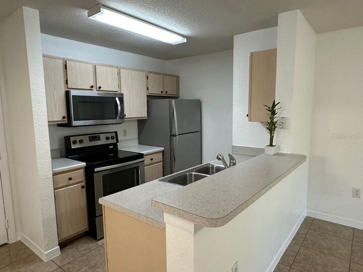 Property Photo: 5479 Vineland Road 9107 FL 32811