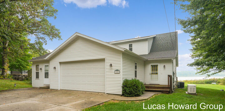 Property Photo:  11591 Wabasis Lake Drive NE  MI 48838 