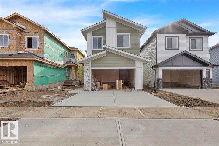 Property Photo:  57 Blackbird Bend  AB T8L 0G6 