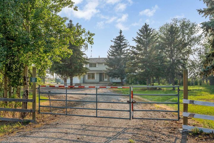Property Photo: 233081 Glenmore View Road AB T1X 0H3