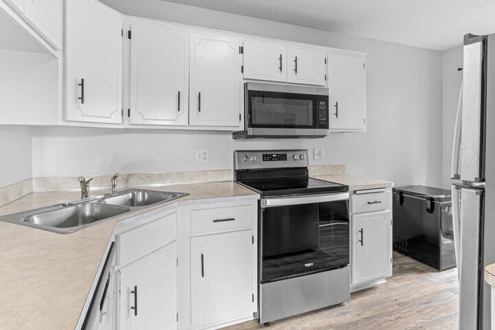 Property Photo: 7610 15th Street Lane N 907 MN 55128