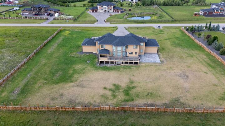 Property Photo:  283185 Serenity Place  AB T1Z 0L7 