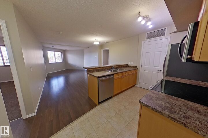 Property Photo:  6921 199 Street NW 302  AB T5T 3X7 