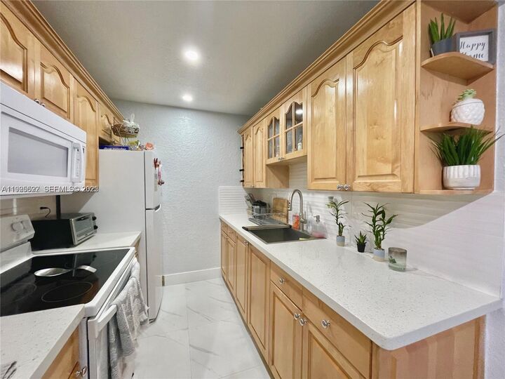 Property Photo:  7110 Fairway Dr L24  FL 33014 