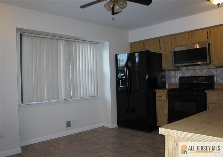 Property Photo:  6107 N Oaks Boulevard  NJ 08902 