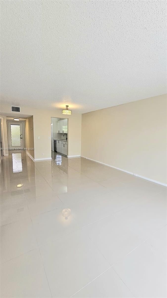 Property Photo:  1401 SW 128th Ter 410H  FL 33027 