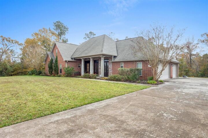 Property Photo:  1663 S Woodland Forest Drive S  LA 70611 