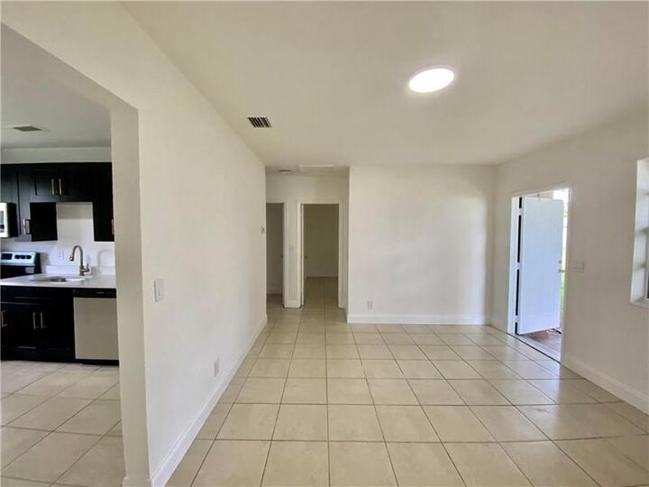 Property Photo: 721 NW 1st Ct FL 33009
