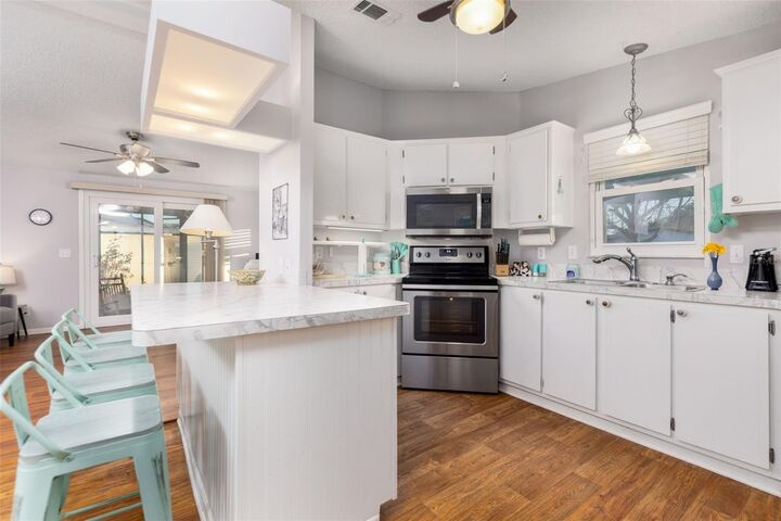 Property Photo:  605 Rainbow Boulevard  FL 32159 