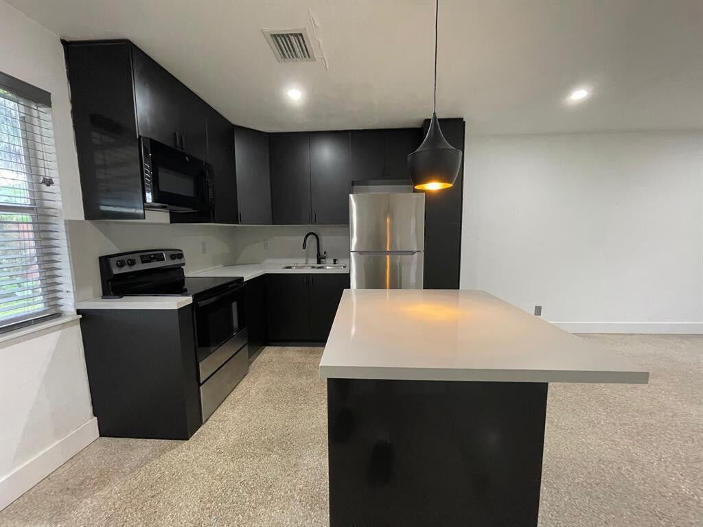 Property Photo:  975 NE 40th Street A  FL 33334 