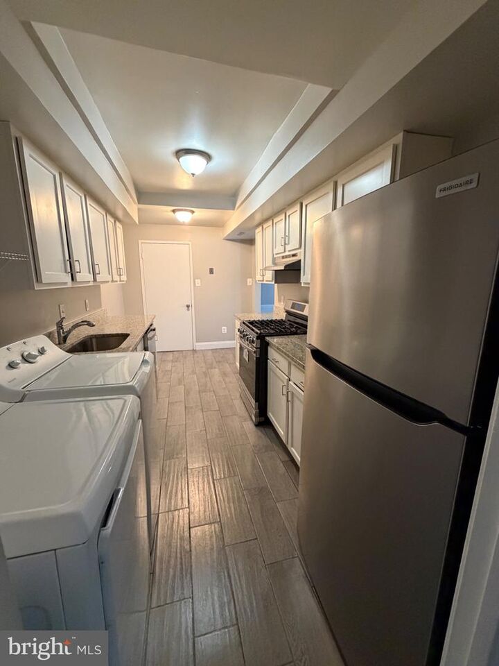 Property Photo:  10242 Prince Place 206  MD 20774 