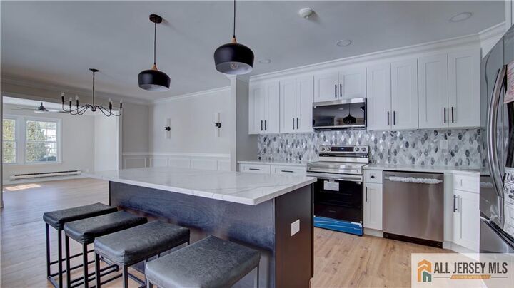 Property Photo:  16 Alexander  Hamilton Court B  NJ 08831 