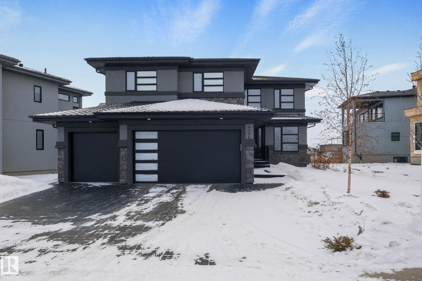 Property Photo: 4086 Whispering River Drive SW AB T6W 2E2