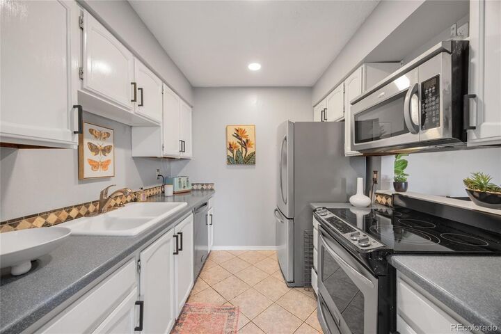 Property Photo: 14469 E 1st Drive A12 CO 80011