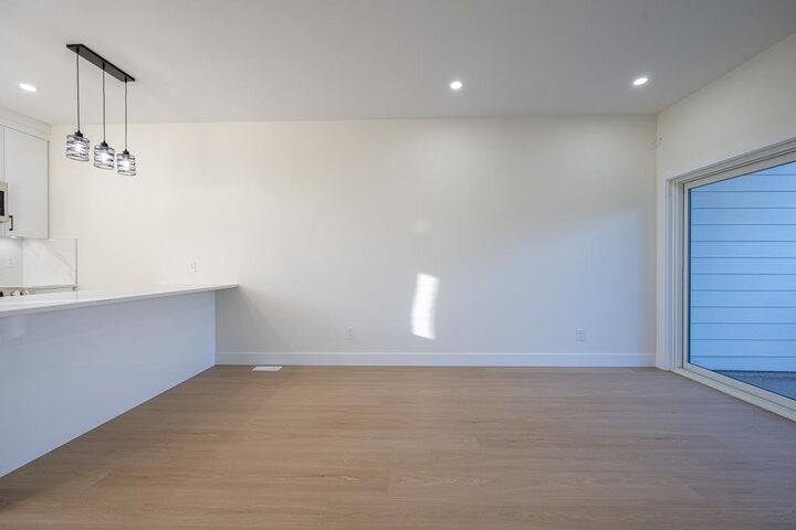 Property Photo:  7533 Wren Street B  BC V2V 3C1 