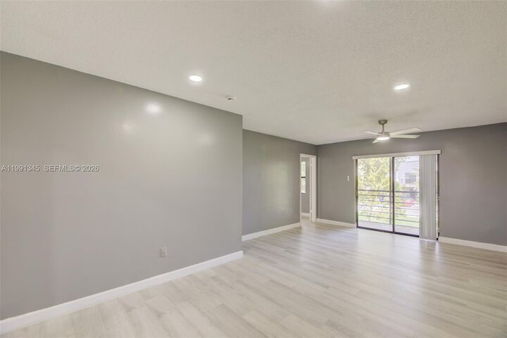 Property Photo:  851 NE 209th Ter 203-23  FL 33179 