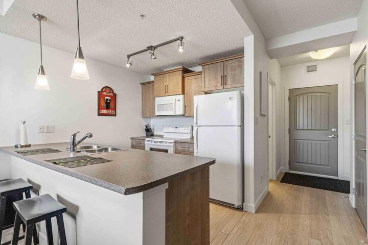 Property Photo:  204 Sparrow Hawk Drive 2117  AB T9K 0P1 