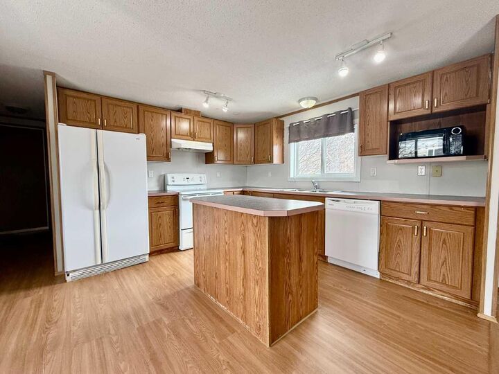 Property Photo: 116 Cokerill Crescent AB T9K 2J3
