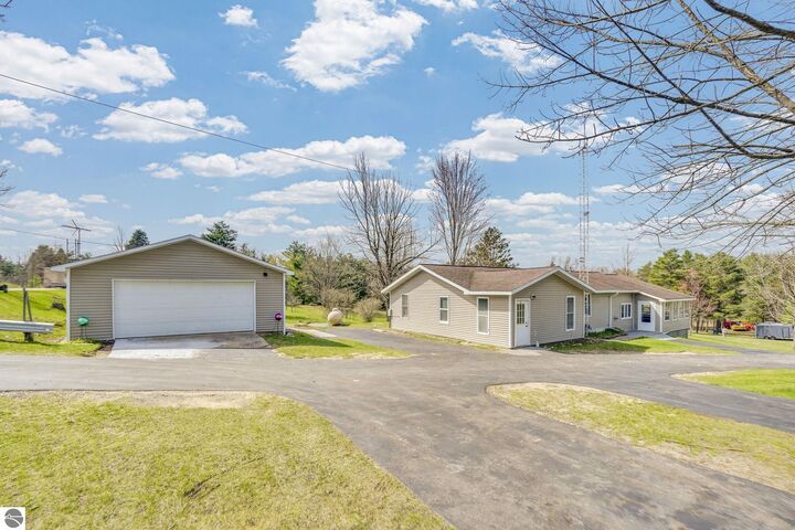 Property Photo:  10976 E 3 Mile Road  MI 49656 