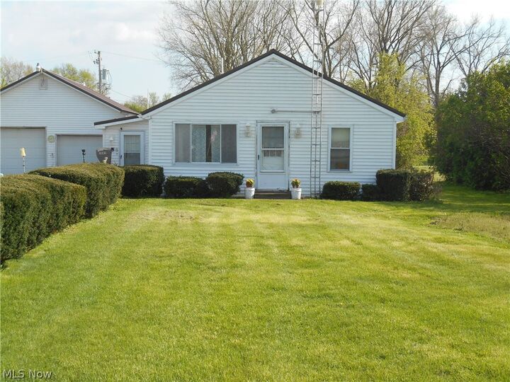 Property Photo:  5845 Woodman Avenue  OH 44004 