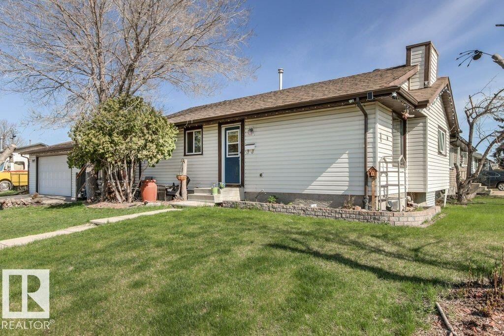 Property Photo:  2104 145 Avenue NW  AB T5Y 1T9 