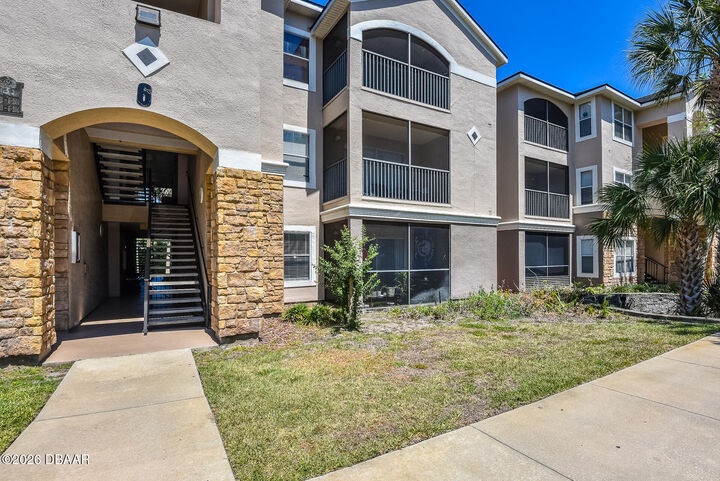 Property Photo:  940 Village Trail 6-103  FL 32127 