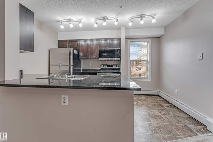 Property Photo:  11803 22 Ave SW 118  AB T6W 2R9 