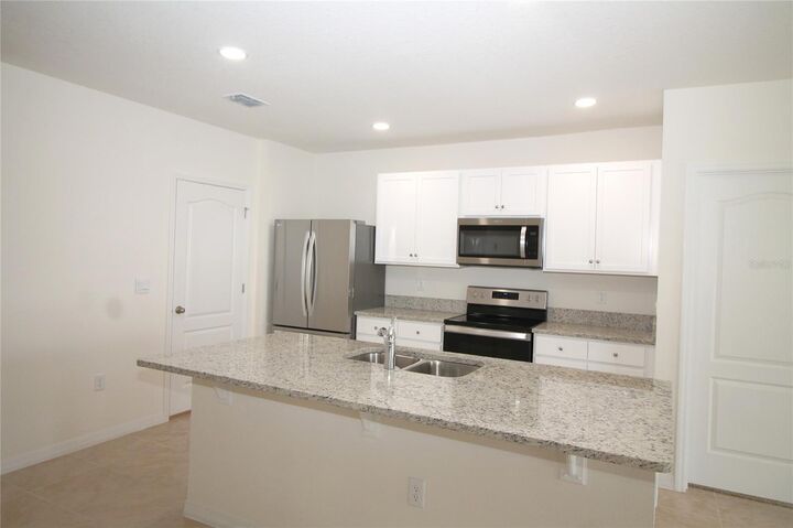 Property Photo:  9488 Black Walnut Drive  FL 34715 
