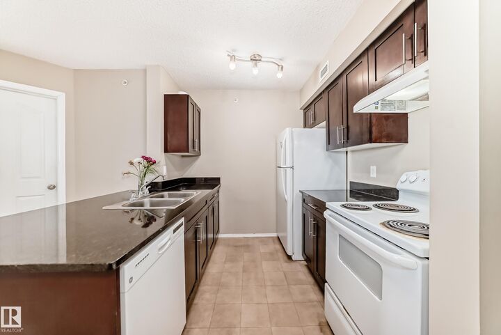 Property Photo:  12025 22 Avenue SW 404  AB T6W 2Y1 