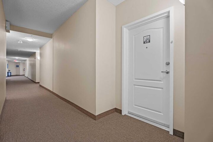 Property Photo:  43 Sunrise Loop SE 215  AB T1V 0A8 