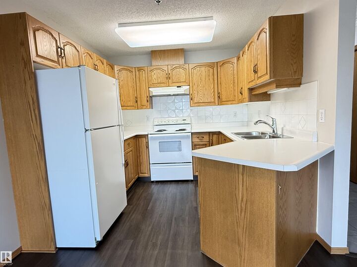 Property Photo:  10610 76 Street NW 309  AB T6A 3Y9 