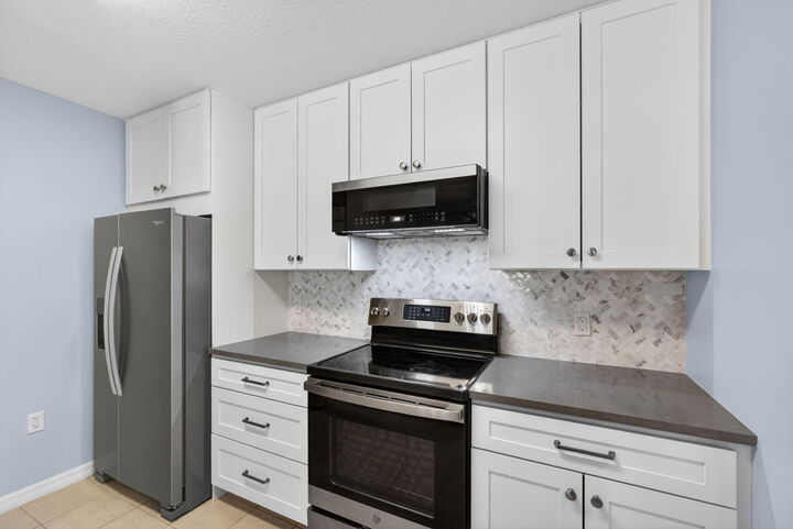 Property Photo:  1203 Town Center Drive Drive 308  FL 33458 