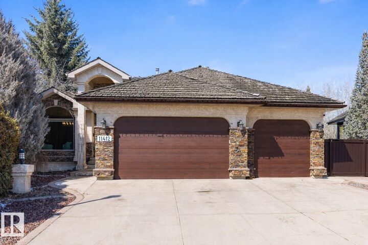Property Photo:  11412 12 Avenue NW  AB T6J 6W8 