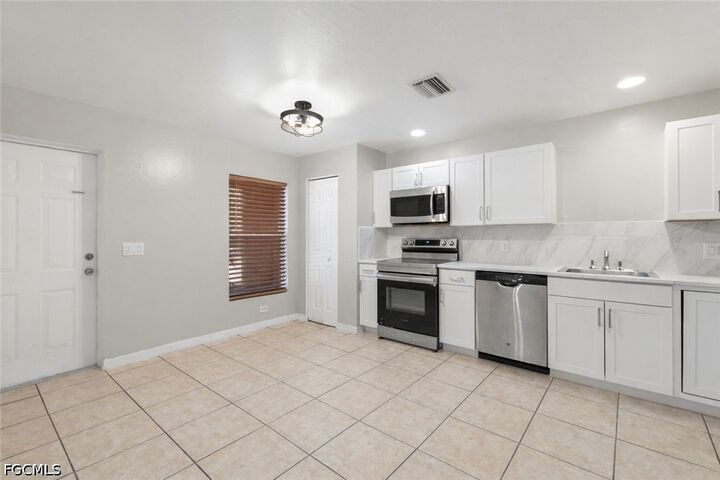 Property Photo: 2405/2407 George Avenue S FL 33973