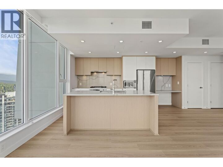 Property Photo: 567 Clarke Road 2901 BC V3J 0K7
