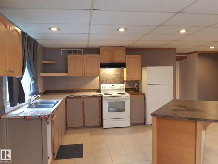 Property Photo:  3809 112 Avenue NW  AB T5W 0M5 