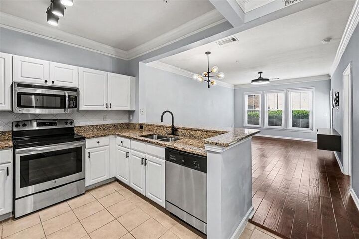 Property Photo:  1850 Cotillion Drive 2102  GA 30338 