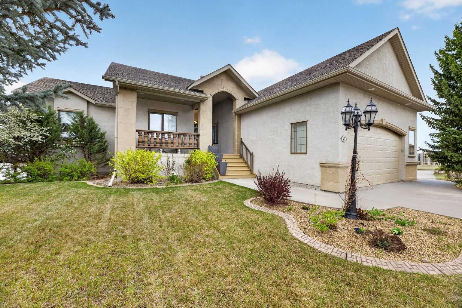Property Photo: 23 Lake Ridge AB T4H 1W6